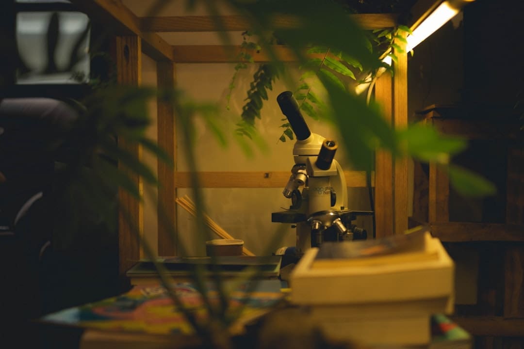 pets lower blood pressure. Microscope in a wooden enclosure with plants